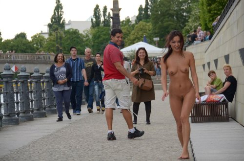 Girl undresses in public