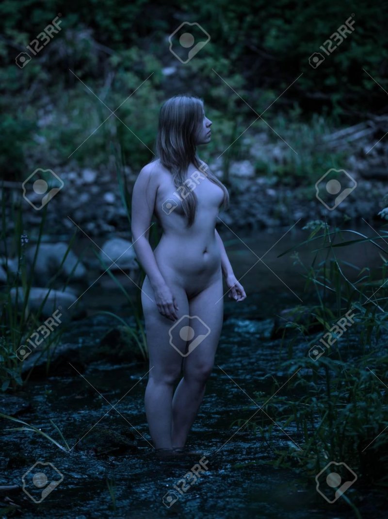 Nude woman in forest
