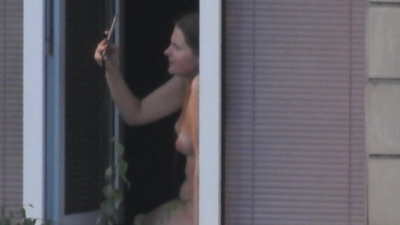Peeping out the windows naked