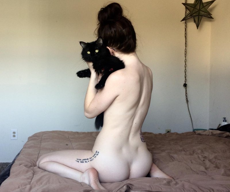 Naked girl with a cat