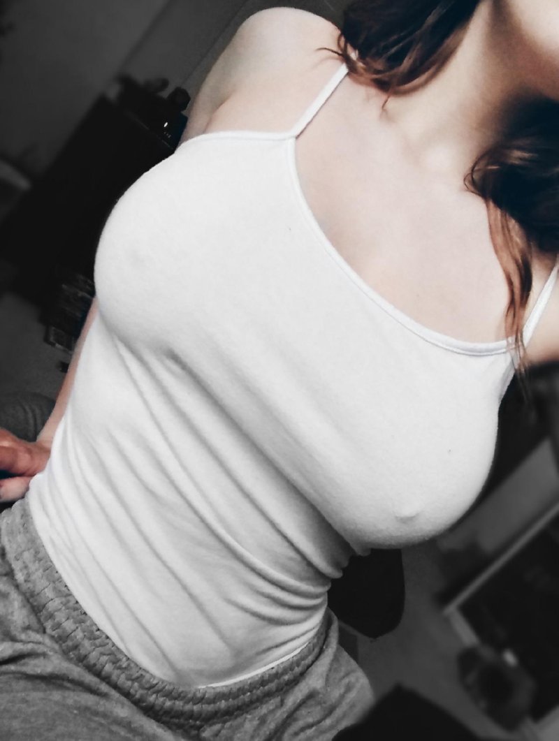 Beautiful breasts under a T -shirt