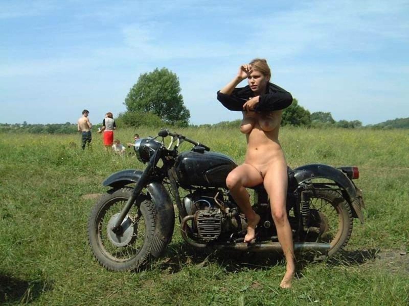 Naked in the village on a motorcycle