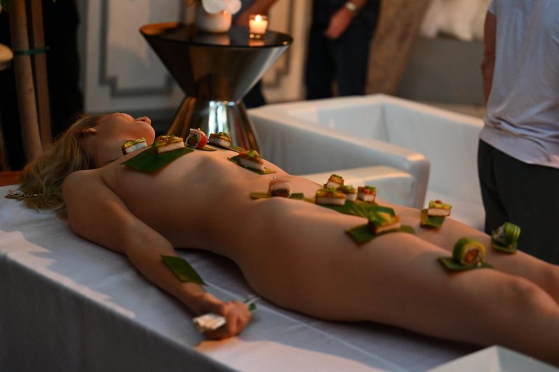 Sushi on a naked woman