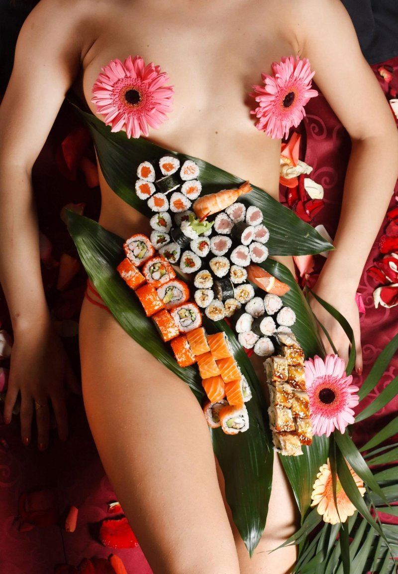 Sushi on the body of a girl