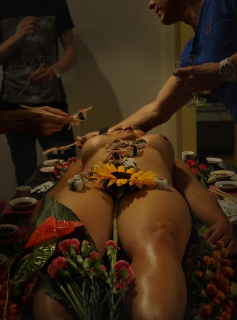 Sushi on a naked woman