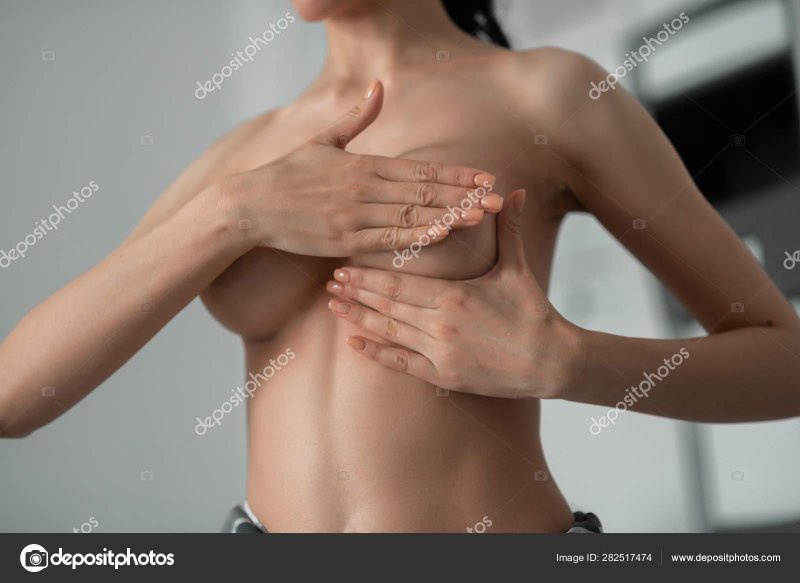 Girl covers her chest with hands