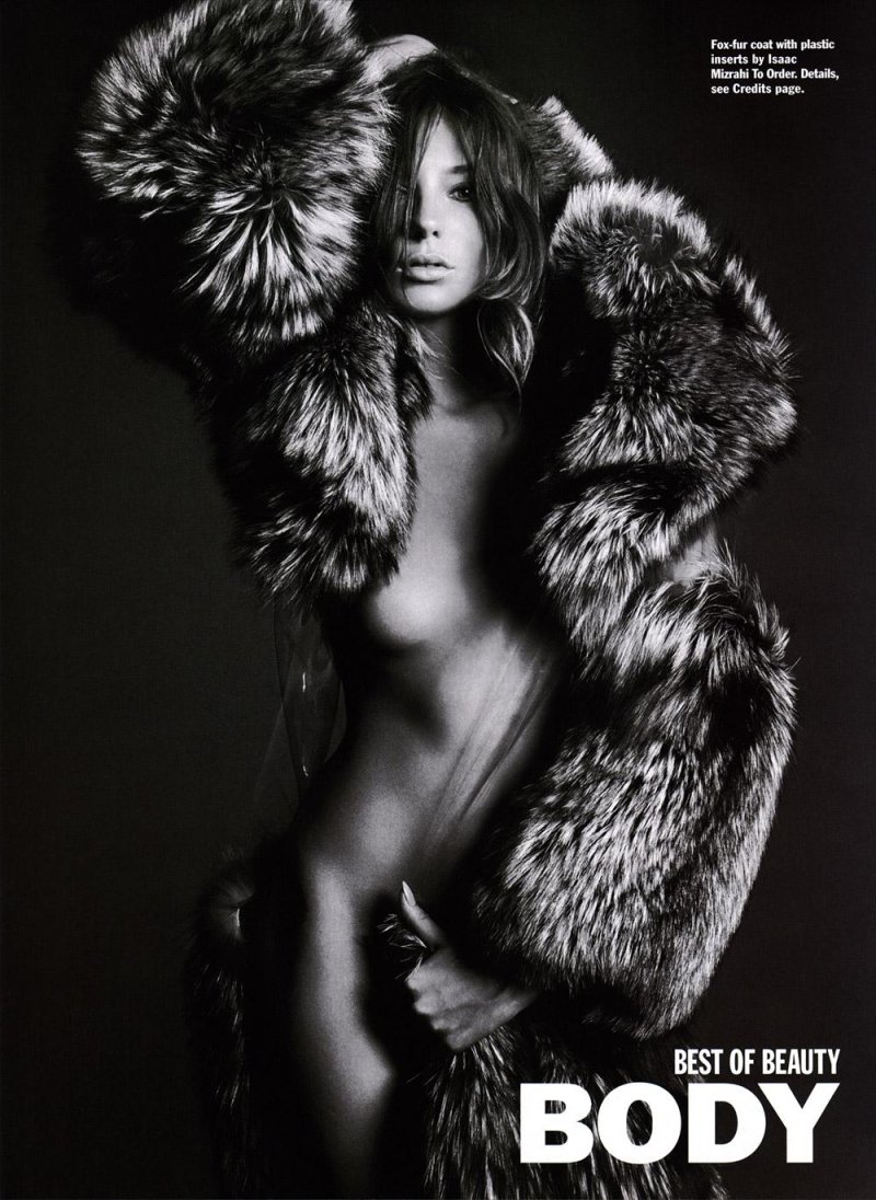 In a fur coat on naked body