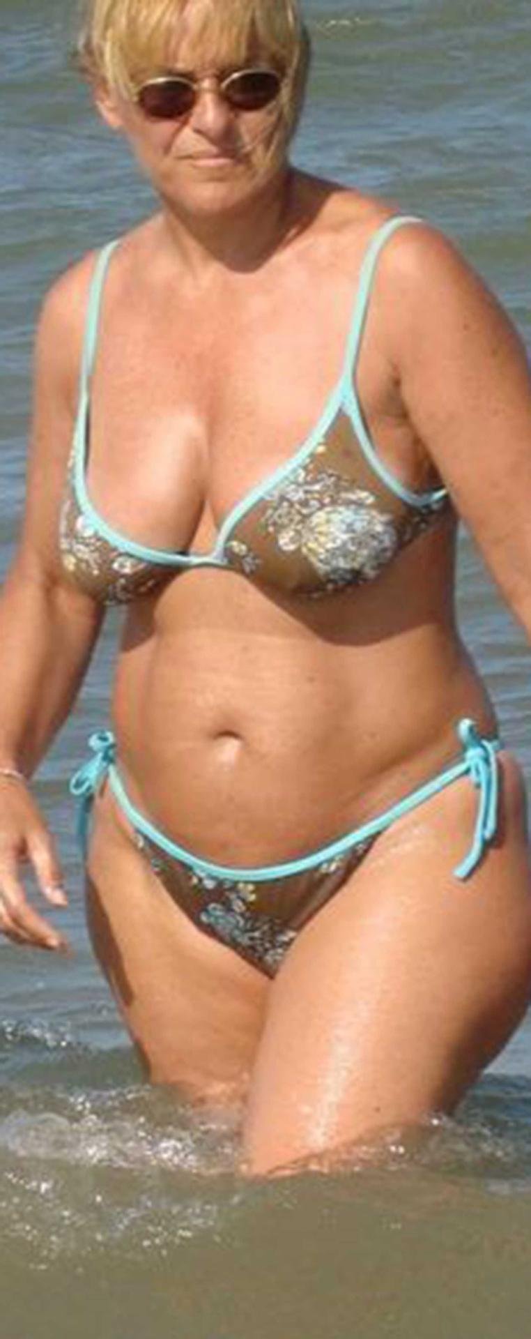 Naked mature on the shore