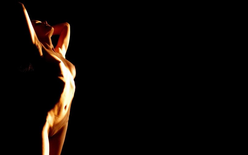 Naked girls on a dark background