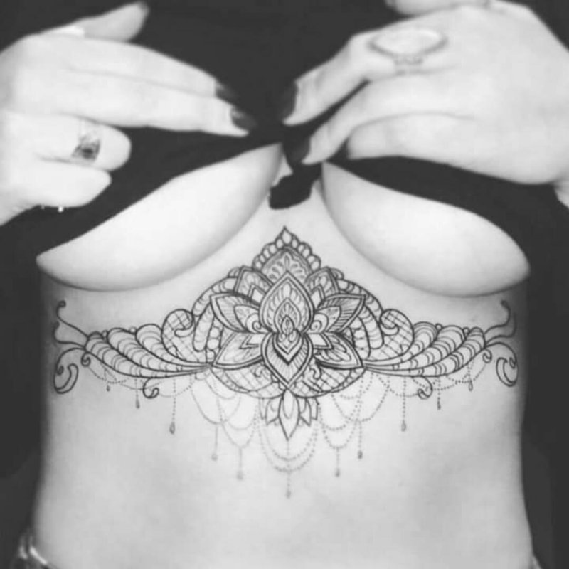Tattoo under the chest of a girl