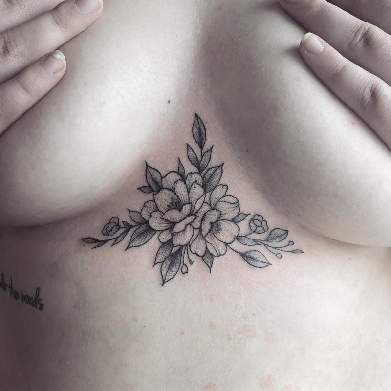 Under the chest tattoo