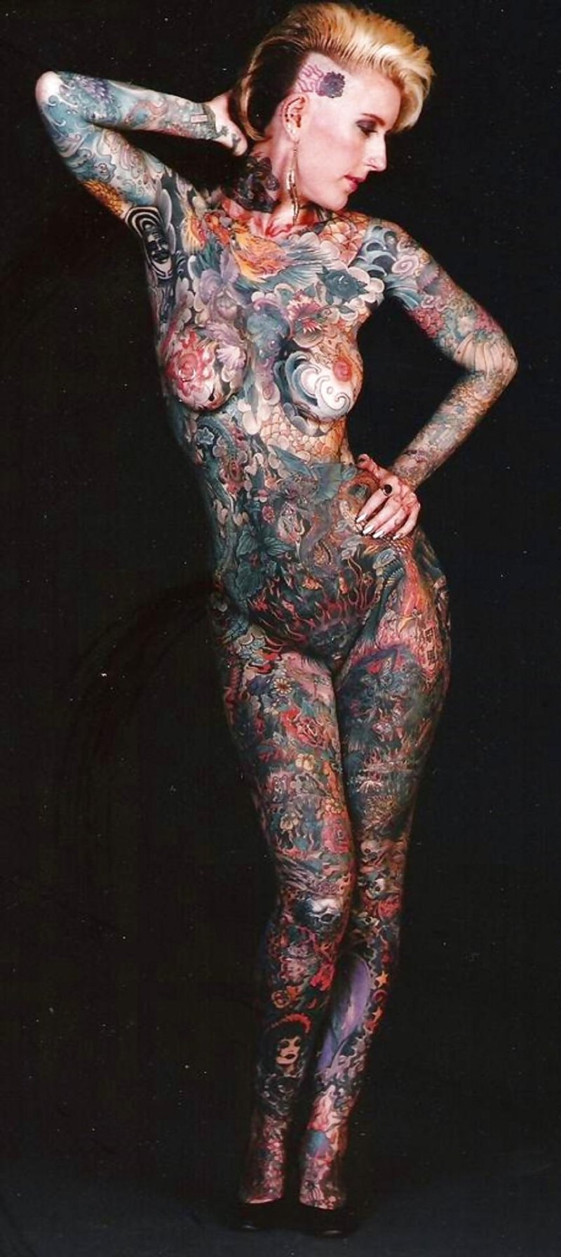 Naked woman all in tattoo