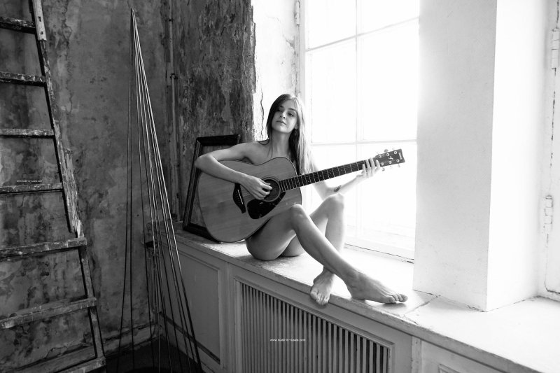 Beautiful girl with a guitar