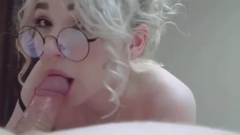 Blonde in glasses sucks a dick
