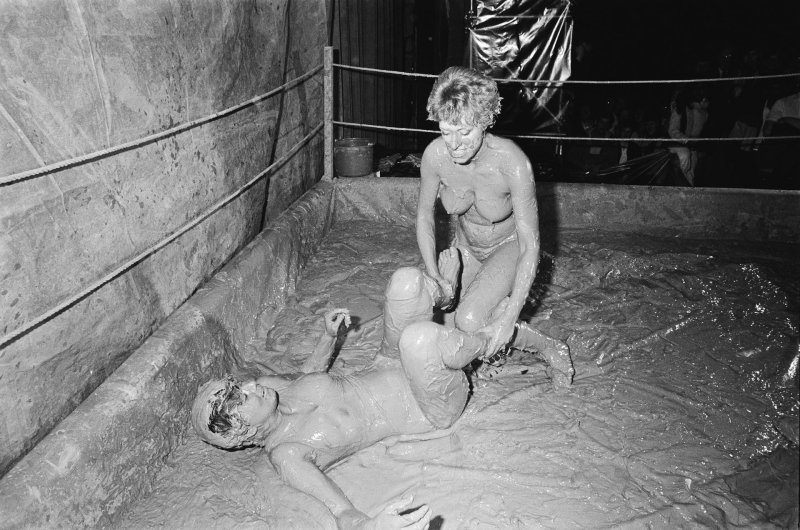 Female fighting in mud