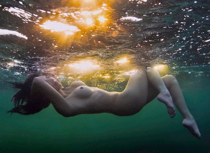 Naked women in water