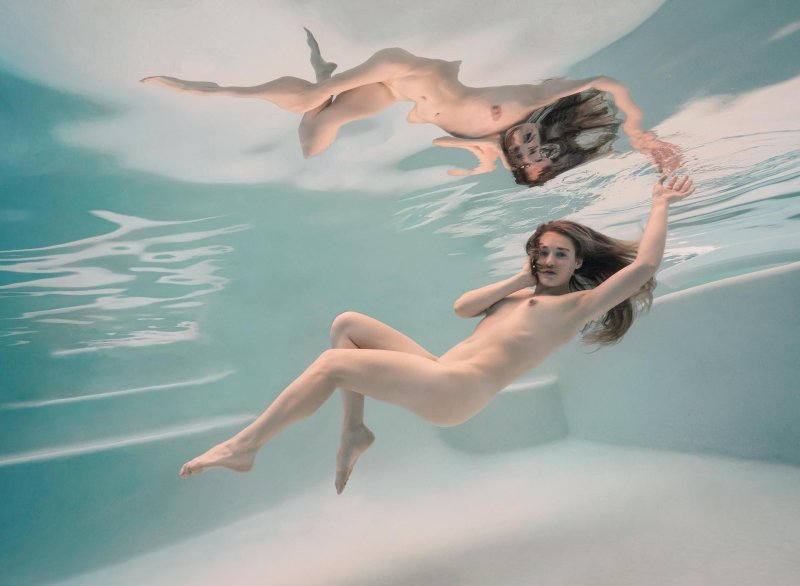 Naked women give birth in water