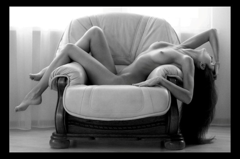 Erotic photo shoot in an armchair