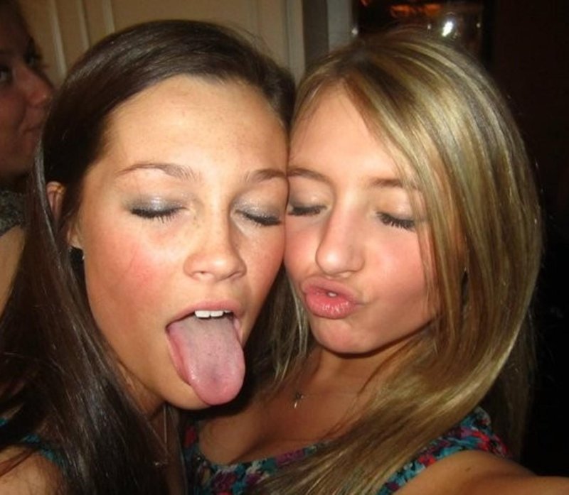 Sisters tongues out