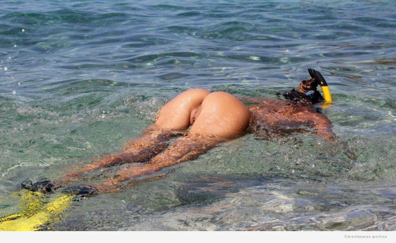 Naked girls swim in the sea