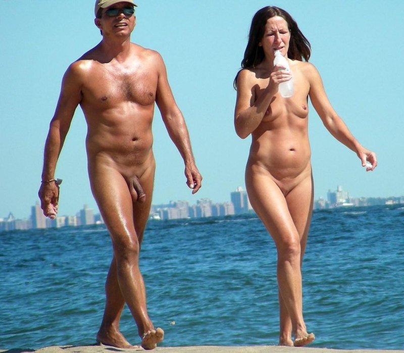 Naked men and women on the beach