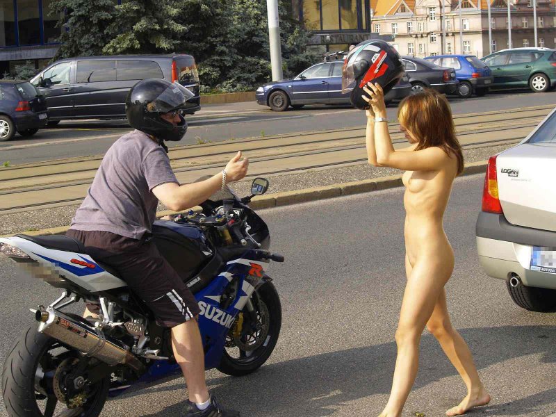 Girl without panties on a motorcycle