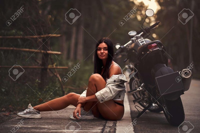 Naked girl on motorcycle