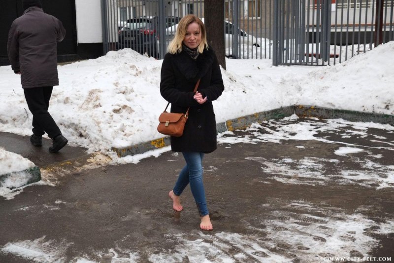 Girl barefoot in winter