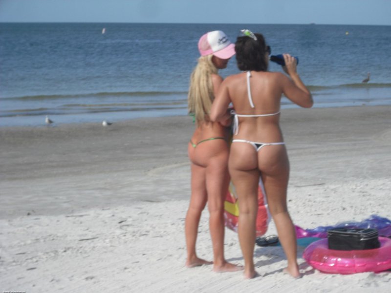Beautiful girls in thongs on the beach