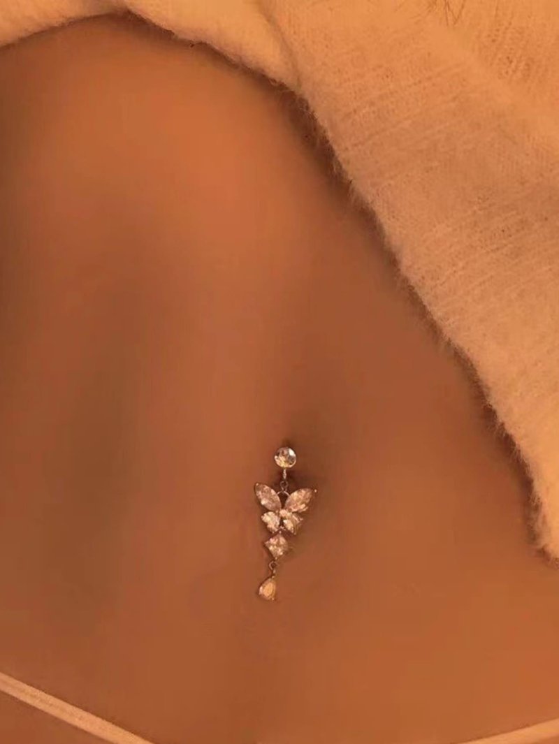 Piercing in the navel butterfly