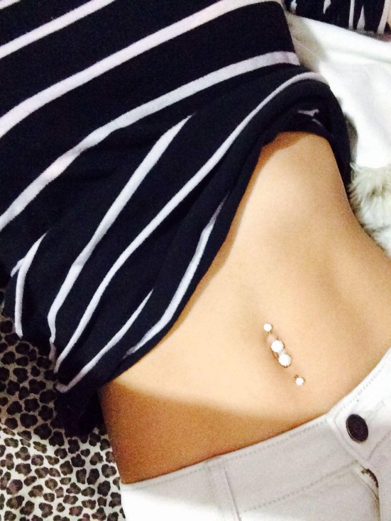 Girl with piercing in her navel