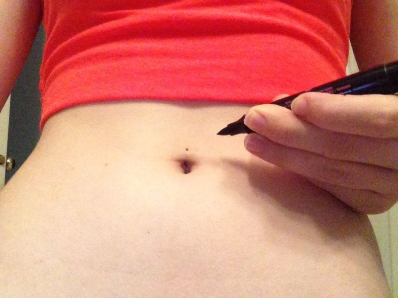 Belly button piercing at