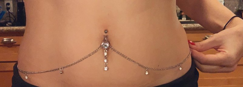 Piercing on the navel with a chain