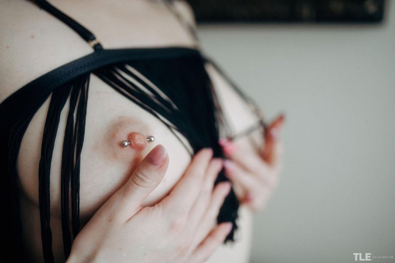 Girl with pierced nipples