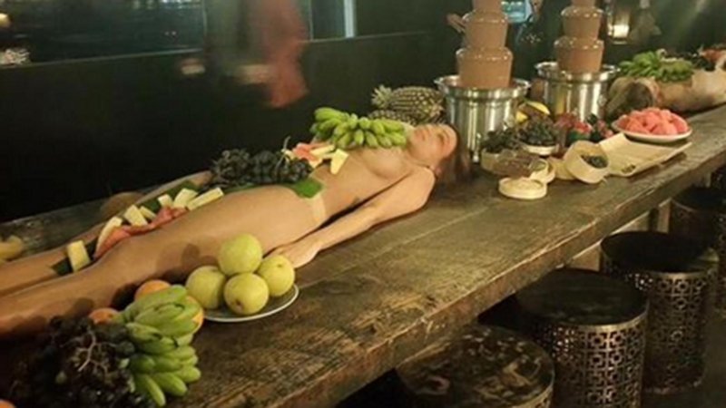 Naked women instead of a table