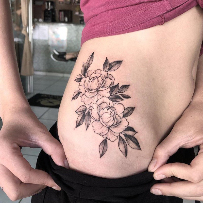 Beautiful tattoo on the stomach for girls