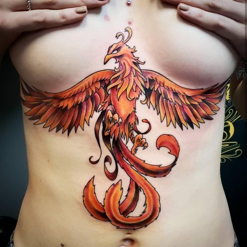 Tattoo Phoenix on the stomach
