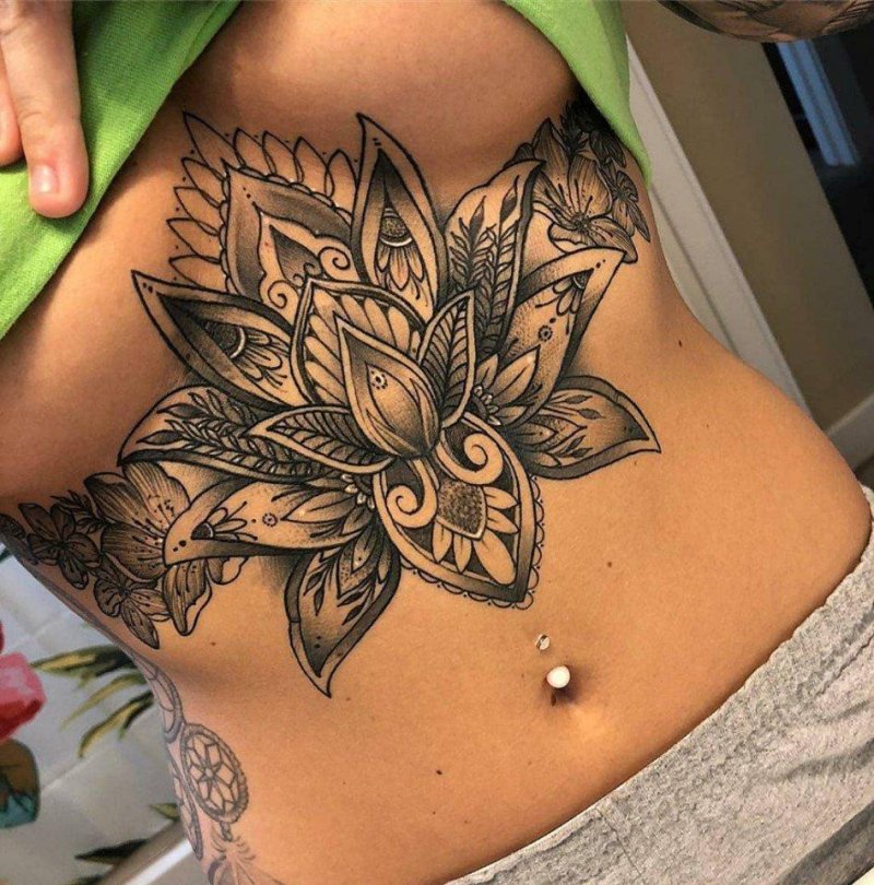 Beautiful female tattoos on the stomach