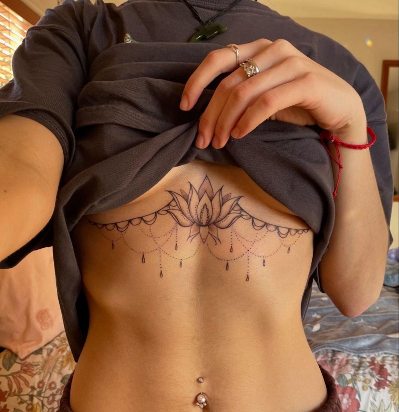Under the chest tattoo