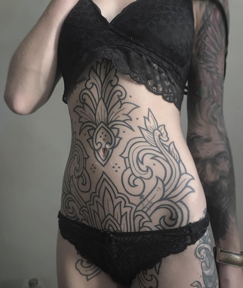 Tattoo mandala on the stomach