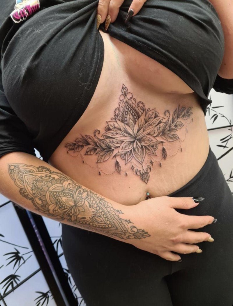 Female tattoos under the chest