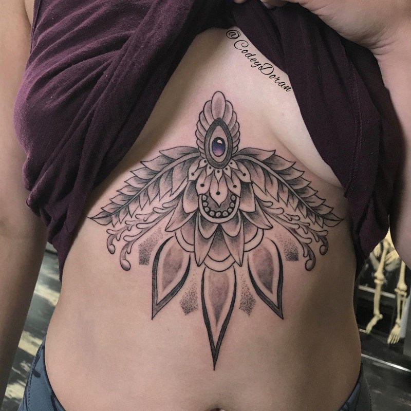 Female tattoos under the chest