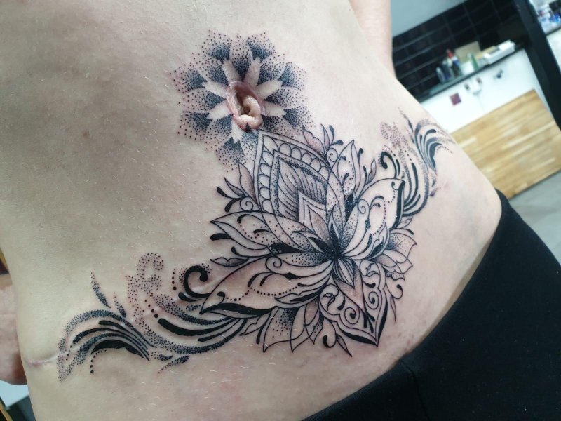 Female tattoos on the stomach