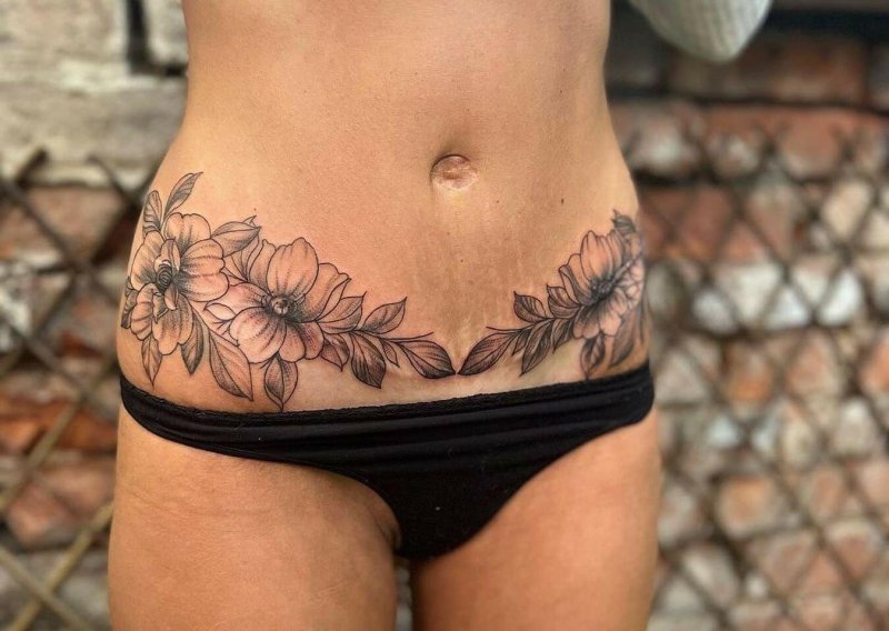 Tattoo on the stomach for girls stretch marks