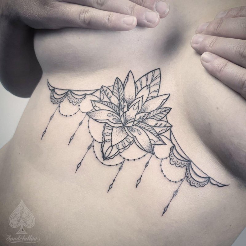 Tattoo lotus under the chest