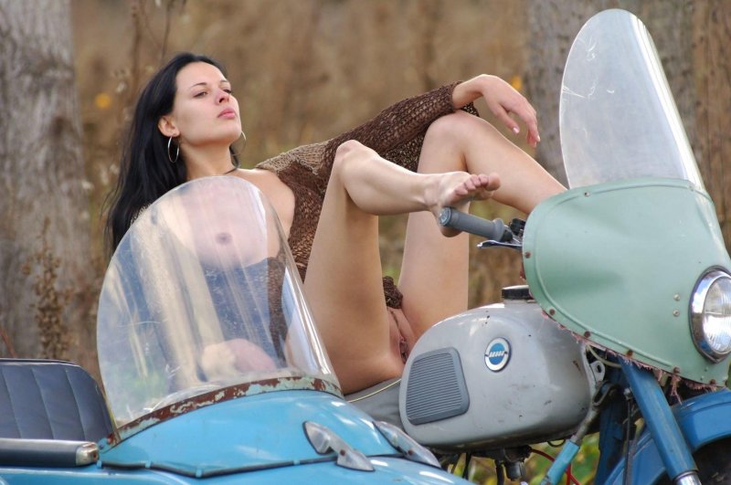 Girl without panties on a motorcycle