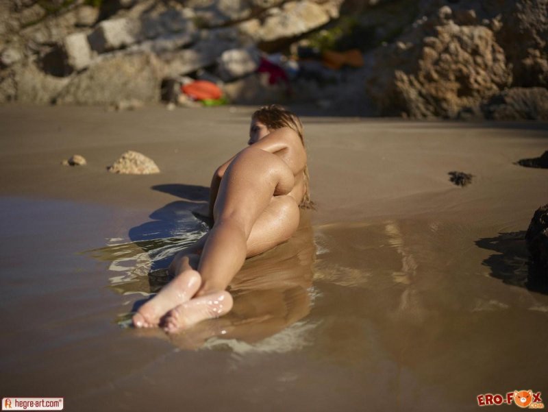 Naked girls by the sea