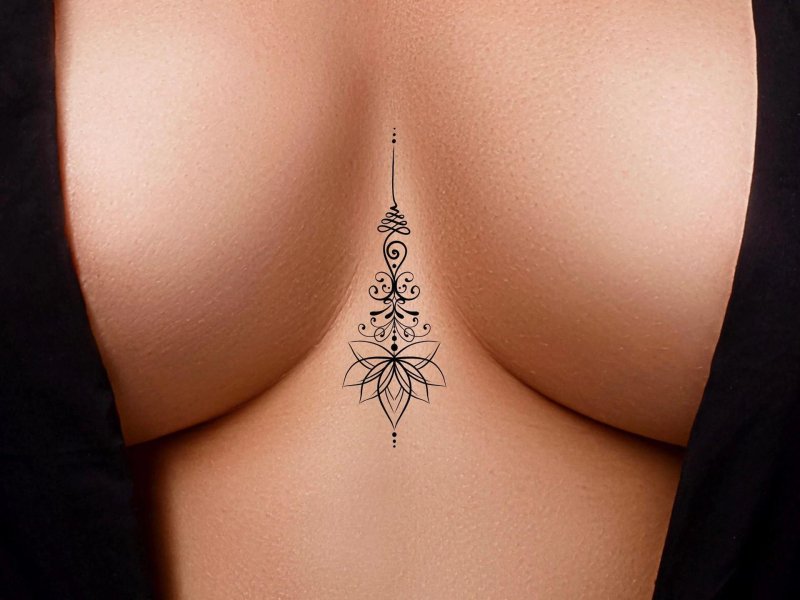 Tattoo between female breast