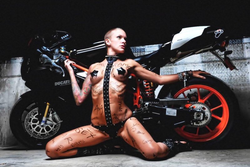 Photo shoot nude on a motorcycle