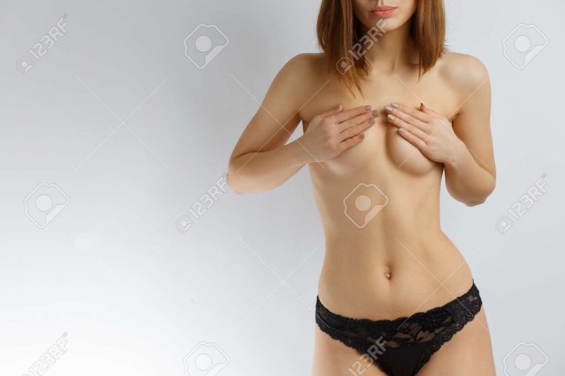 Girl covers her chest with hands